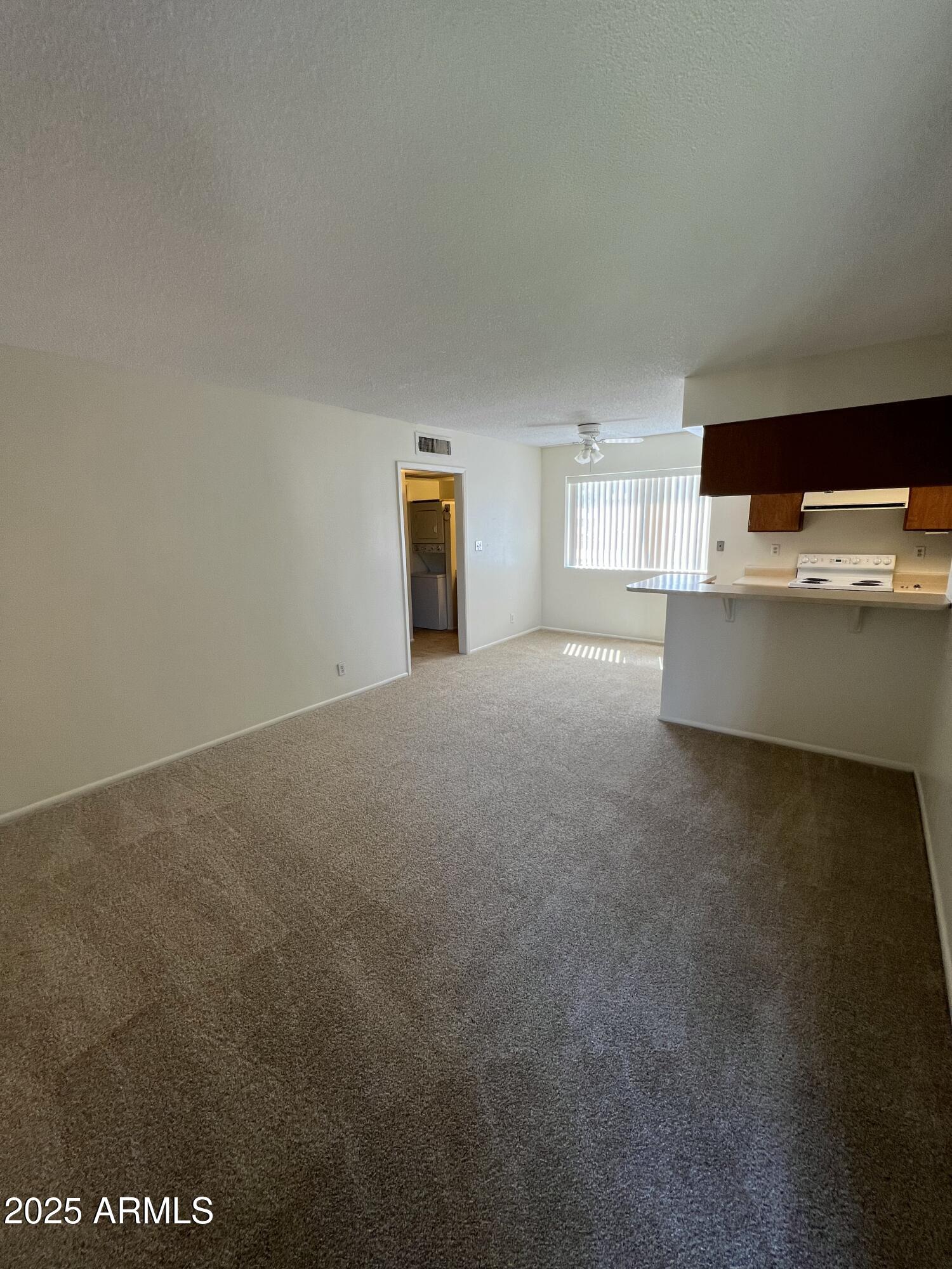 1111 East University Drive, Unit 230 Tempe, AZ 85288 - Photo 2 of 18 a view of an empty room with a window