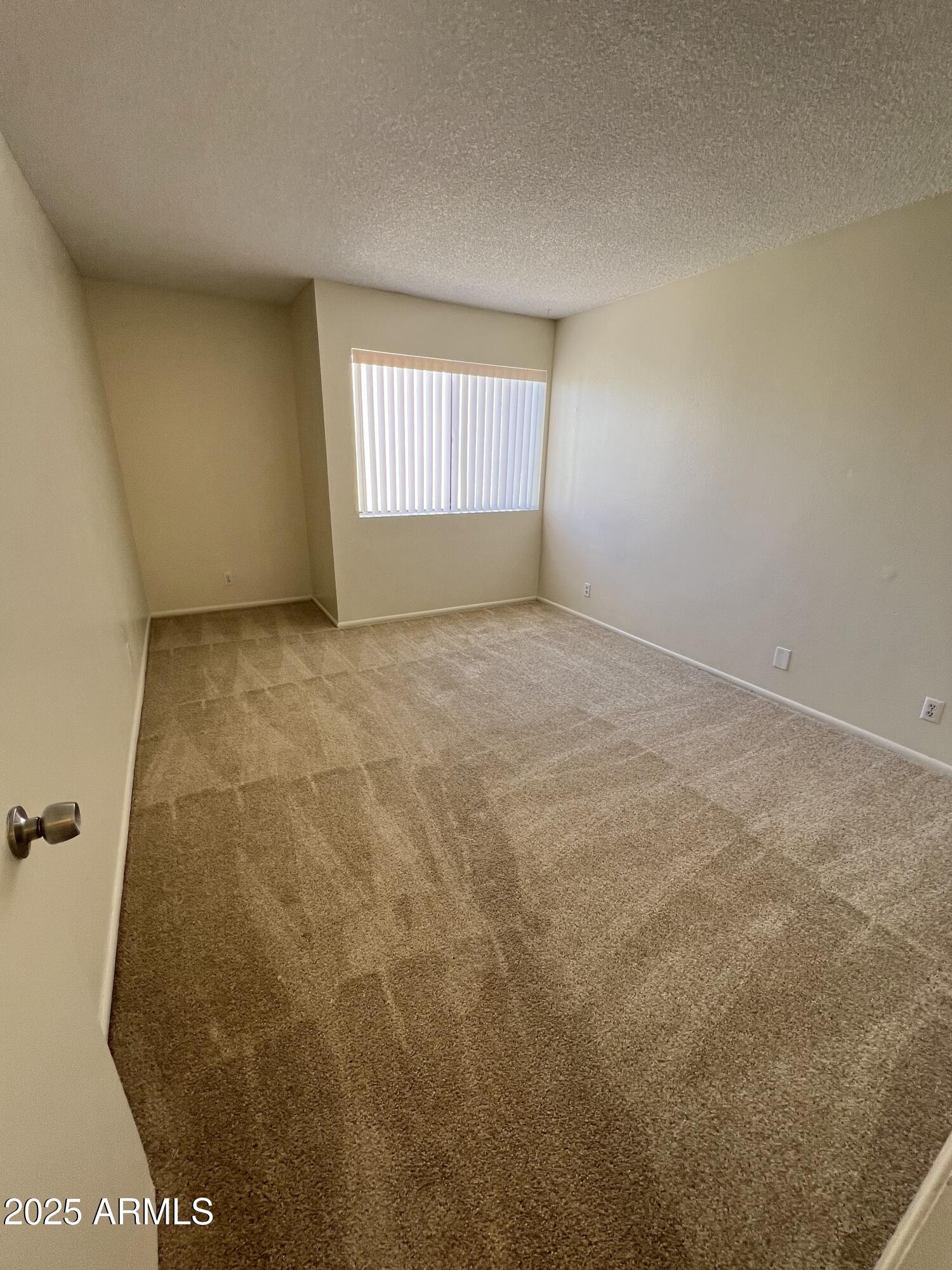 1111 East University Drive, Unit 230 Tempe, AZ 85288 - Photo 4 of 18 a view of an empty room and window