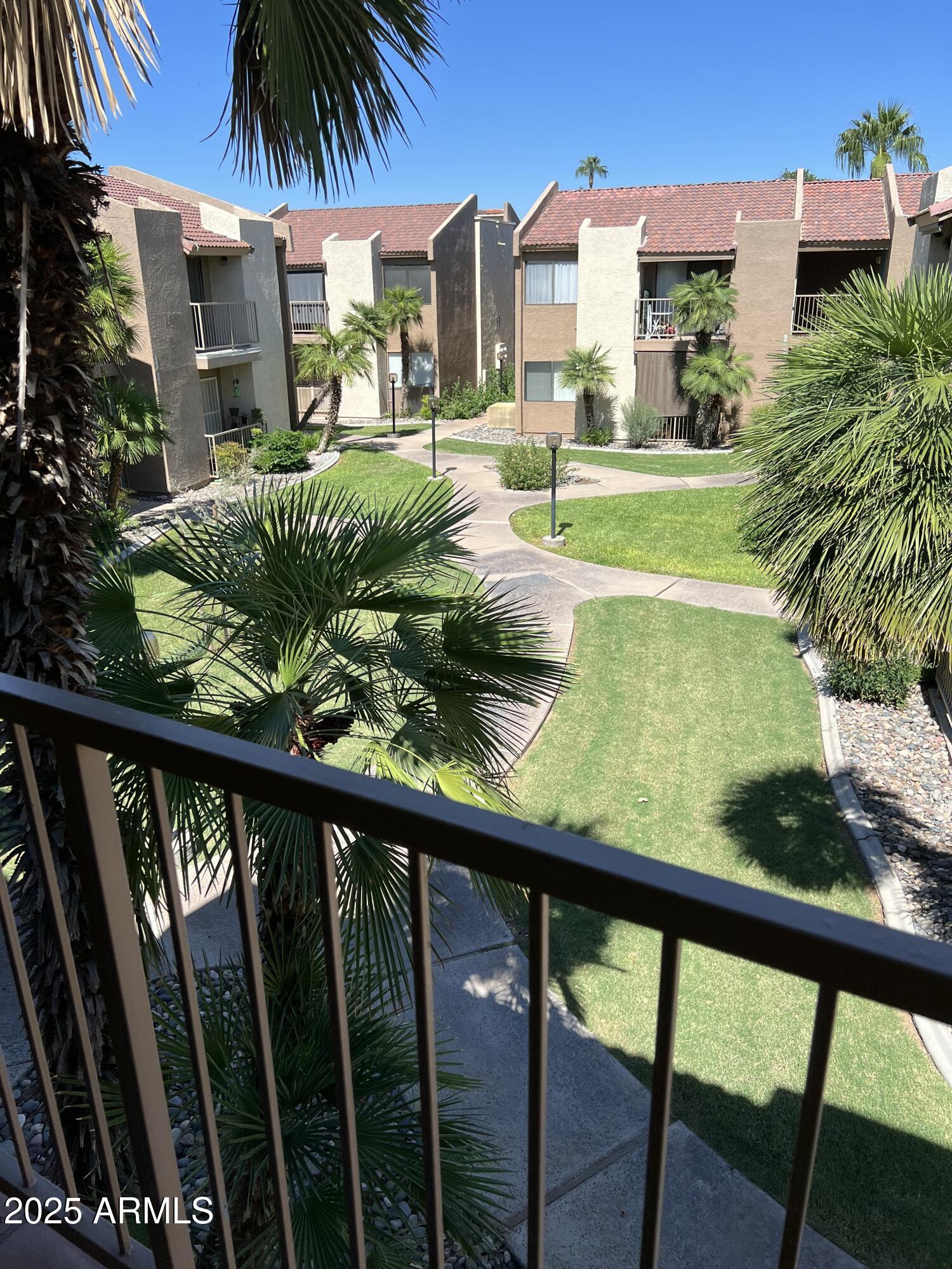 1111 East University Drive, Unit 230 Tempe, AZ 85288 - Photo 7 of 18 a view of swimming pool from a balcony
