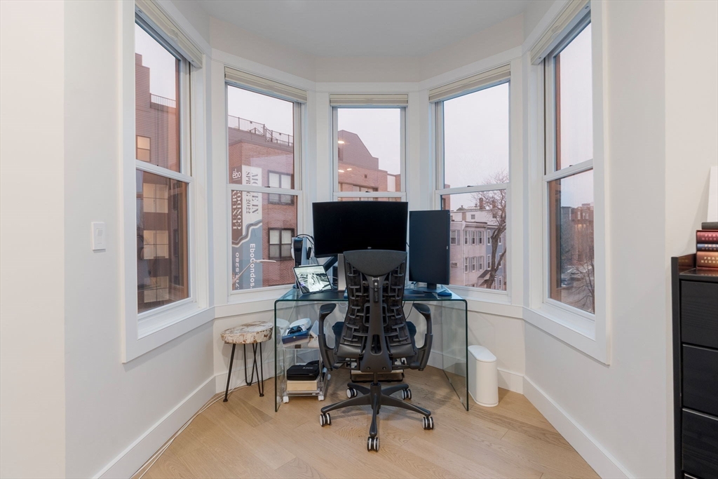 202 Maverick Street, Unit 301 Boston, MA 02128 - Photo 15 of 28 a view of a workspace with furniture and a window
