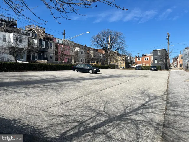 a view of a city street with tall buildings