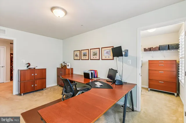 a bedroom with a bed and a chair