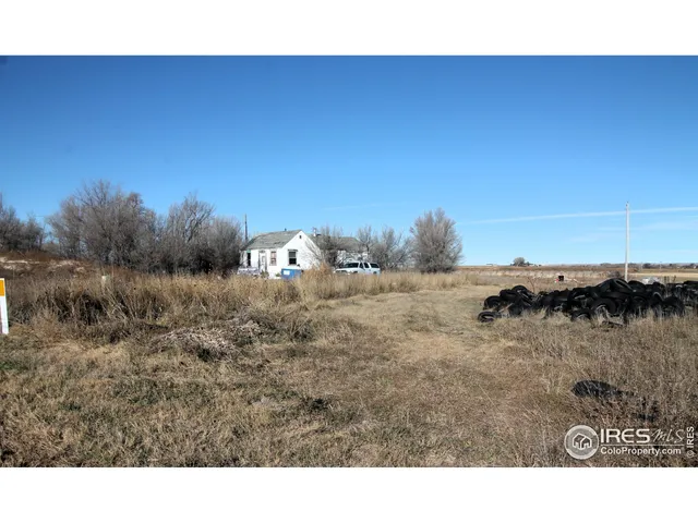 a view of a road with a yard