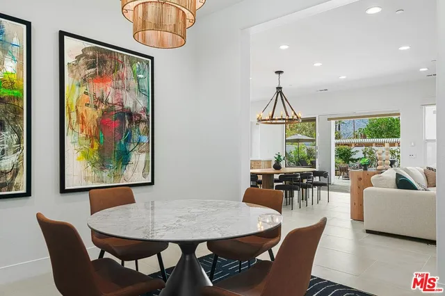 a view of a dining room with furniture window and outside view