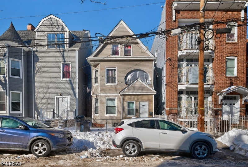 a front view of a house with parking space