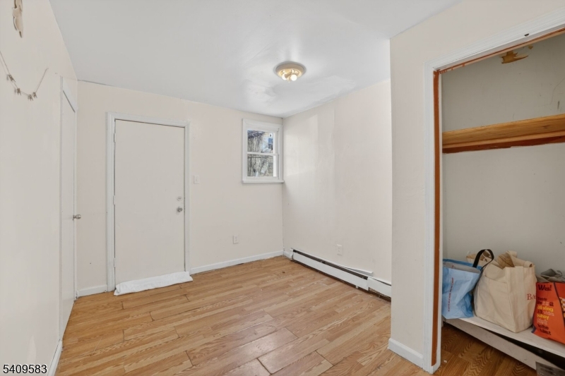 186 3rd Street, Unit 1 Newark, NJ 07107 - Photo 15 of 25 a view of room with window and cabinet