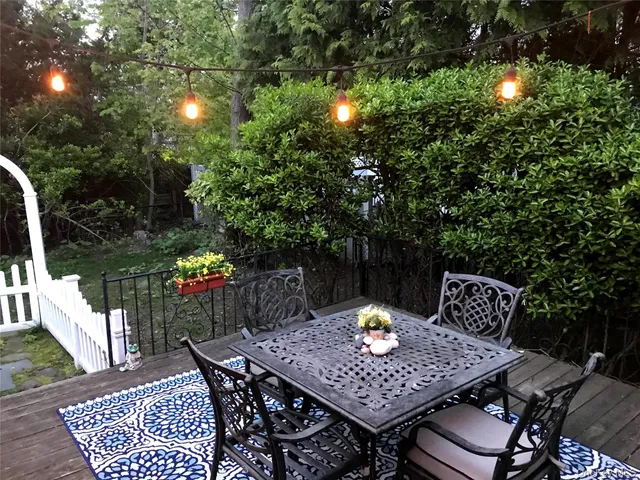 a view of a dinning table and chairs in the patio