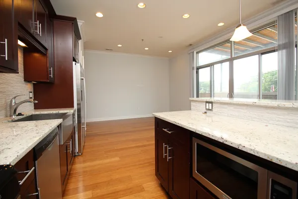 a kitchen with a sink stove and cabinets
