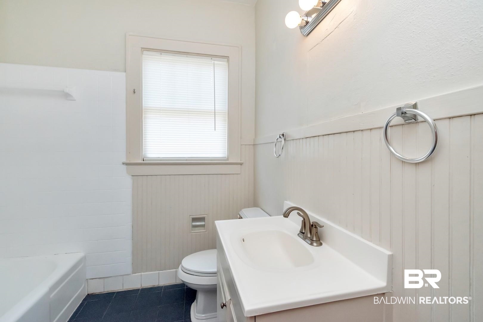 112 South Fulton Street Mobile, AL 36606 - Photo 25 of 35 Bathroom with a bath, tile patterned floors, toilet, and vanity