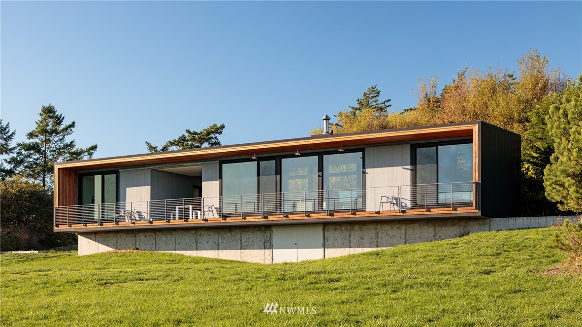 209 Hodgson Road Lopez Island, WA 98261 - Photo 2 of 20 a view of a swimming pool with an outdoor seating