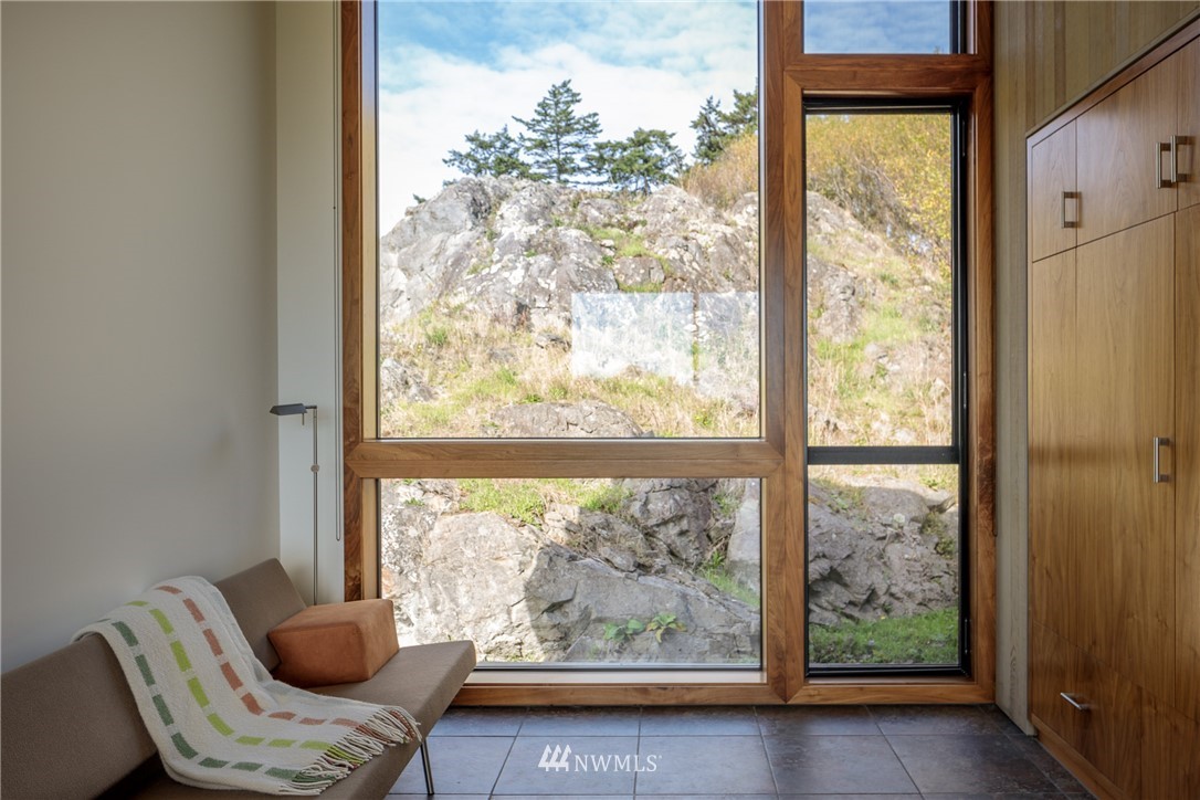 209 Hodgson Road Lopez Island, WA 98261 - Photo 15 of 20 a room with furniture and a large window