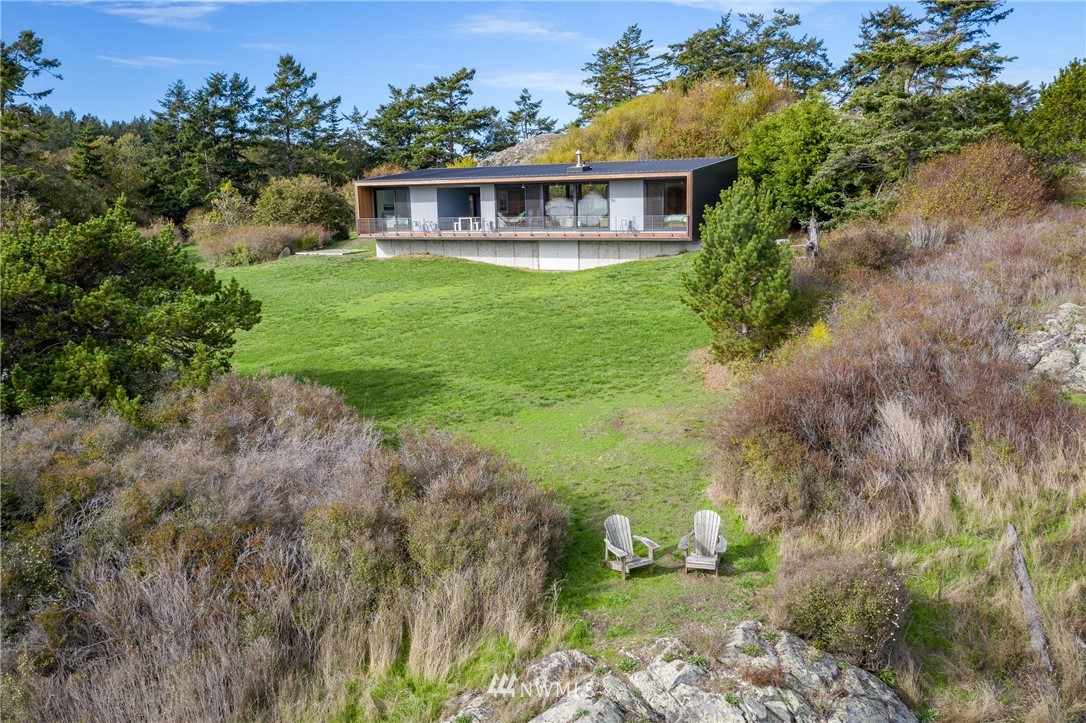 209 Hodgson Road Lopez Island, WA 98261 - Photo 20 of 20 a view of a yard in front of a house with large trees