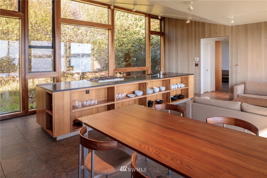 209 Hodgson Road Lopez Island, WA 98261 - Photo 4 of 20 a living room with stainless steel appliances kitchen island furniture and a large window
