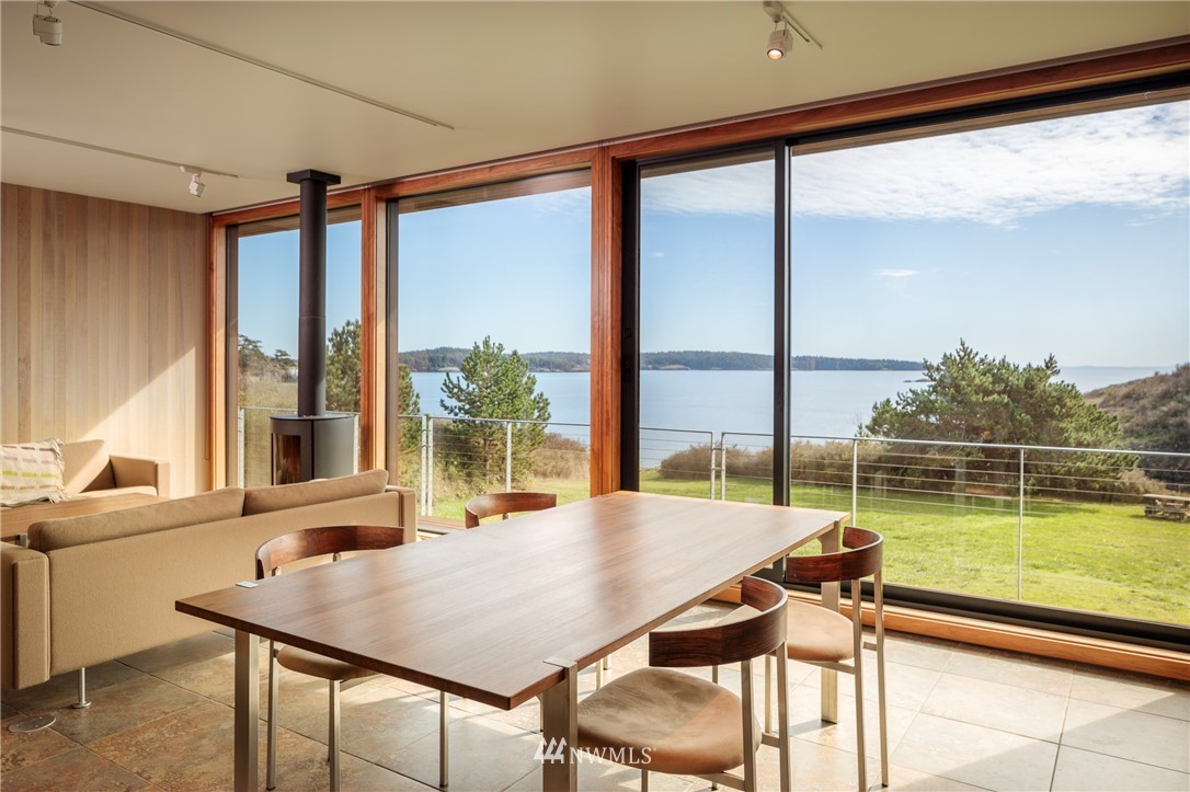 209 Hodgson Road Lopez Island, WA 98261 - Photo 6 of 20 a view of a dining room with furniture and window