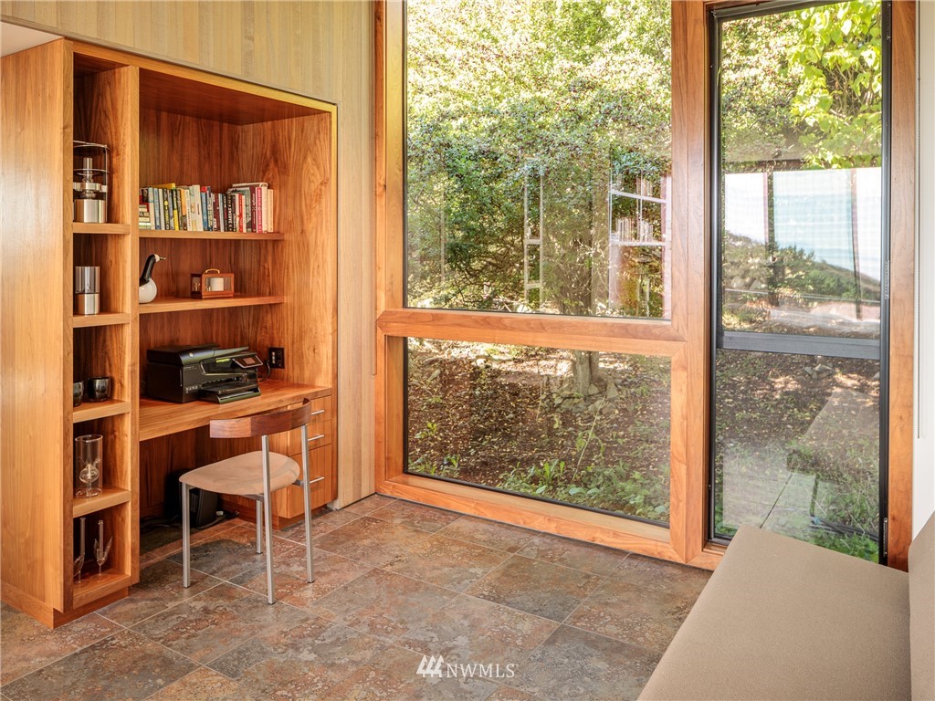 209 Hodgson Road Lopez Island, WA 98261 - Photo 10 of 20 a room with a large window and a view of outdoor space