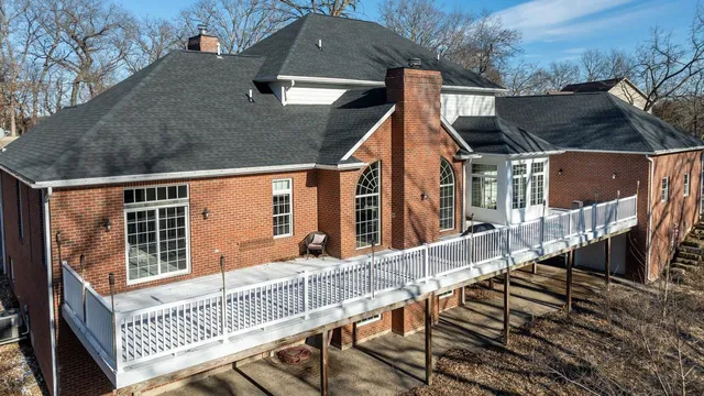 a view of house with a roof deck