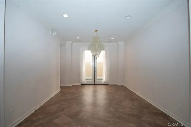 a kitchen with stainless steel appliances granite countertop a refrigerator a sink a stove a microwave and island with wooden cabinets