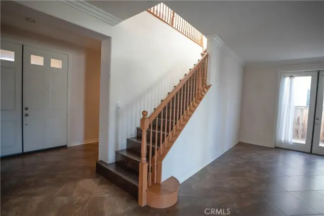 a large kitchen with stainless steel appliances granite countertop a refrigerator a sink a stove a microwave and island with wooden cabinets