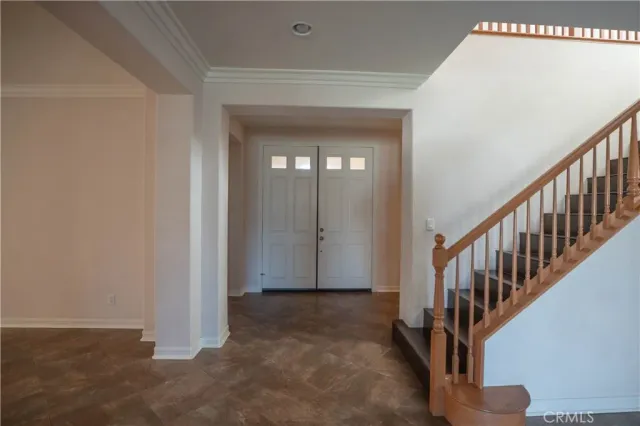 a kitchen with granite countertop stainless steel appliances a refrigerator and cabinets