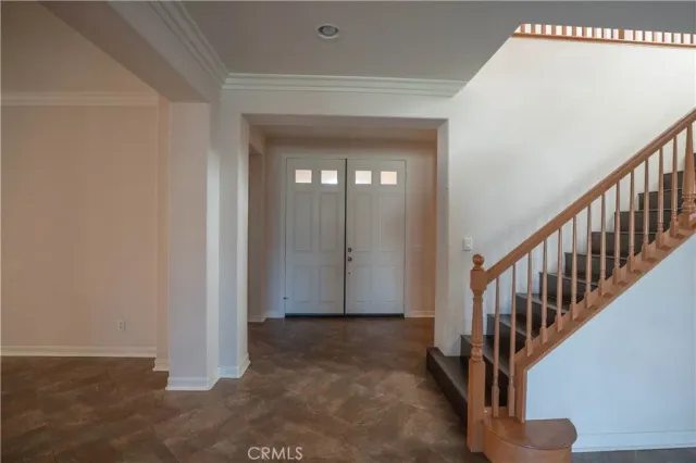 a kitchen with granite countertop stainless steel appliances a refrigerator and cabinets