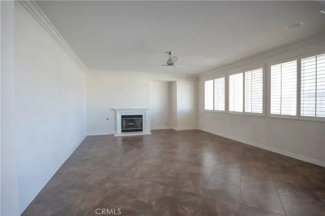 a view of an empty room and wooden floor