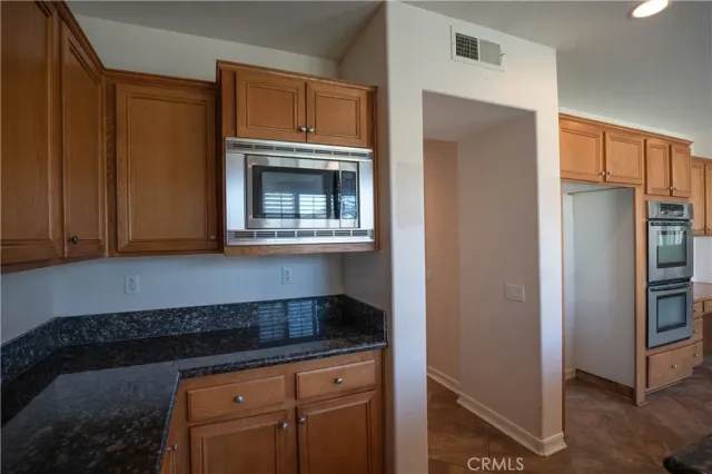a living room with a fireplace and wooden floor