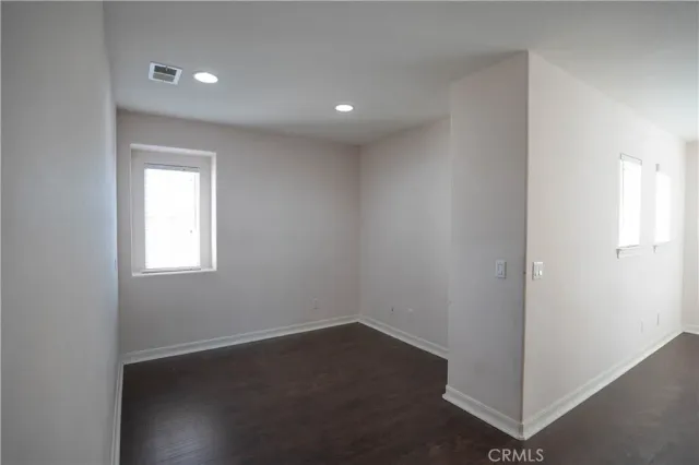 a view of balcony with wooden floor and fence