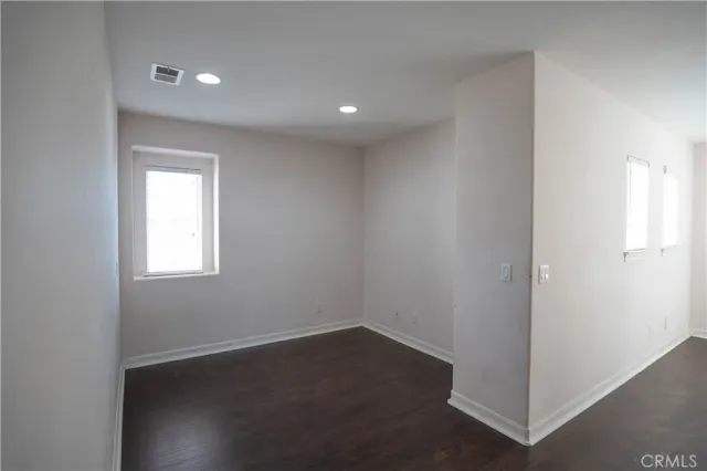 a view of balcony with wooden floor and fence