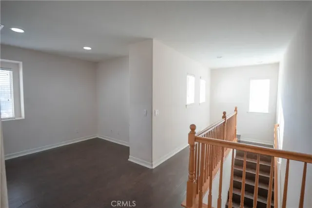 a view of backyard with a deck and wooden floor