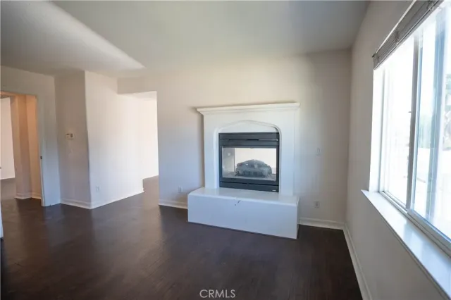 a bathroom with a sink double vanity granite tub and a mirror
