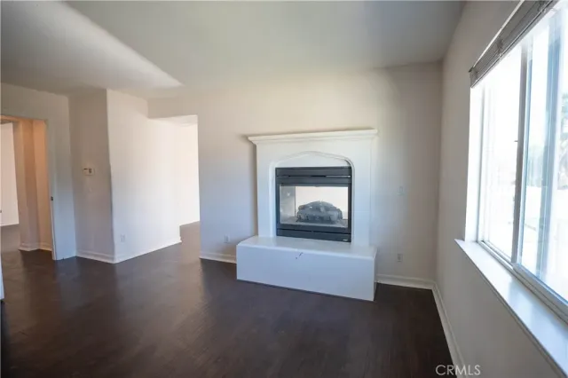 a bathroom with a sink double vanity granite tub and a mirror