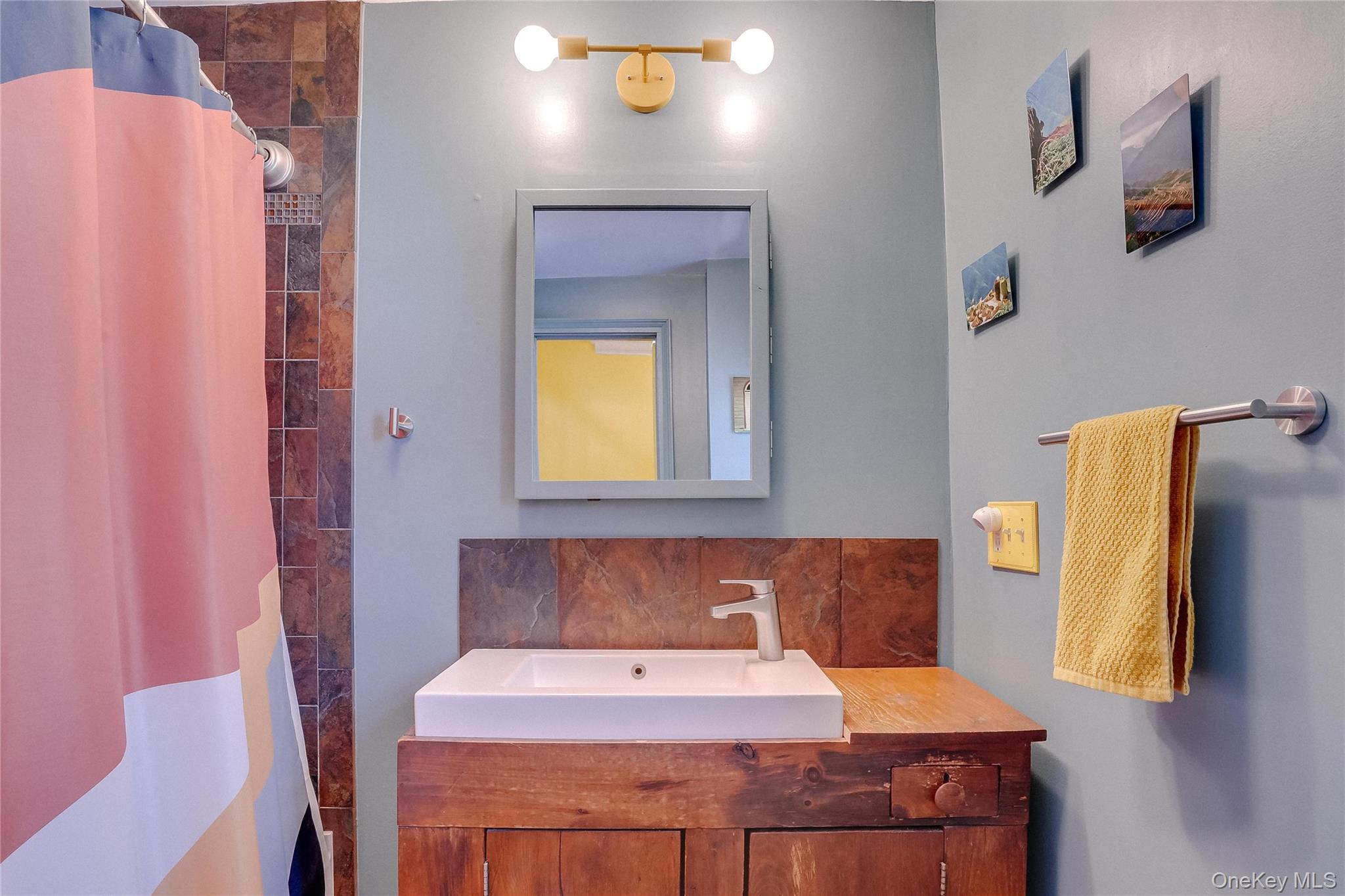 46 Union Street Montgomery, NY 12549 - Photo 13 of 38 a bathroom with a sink and a mirror