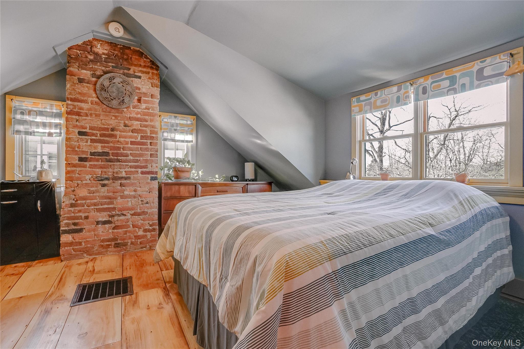 46 Union Street Montgomery, NY 12549 - Photo 18 of 38 a bed sitting in a bedroom next to a window