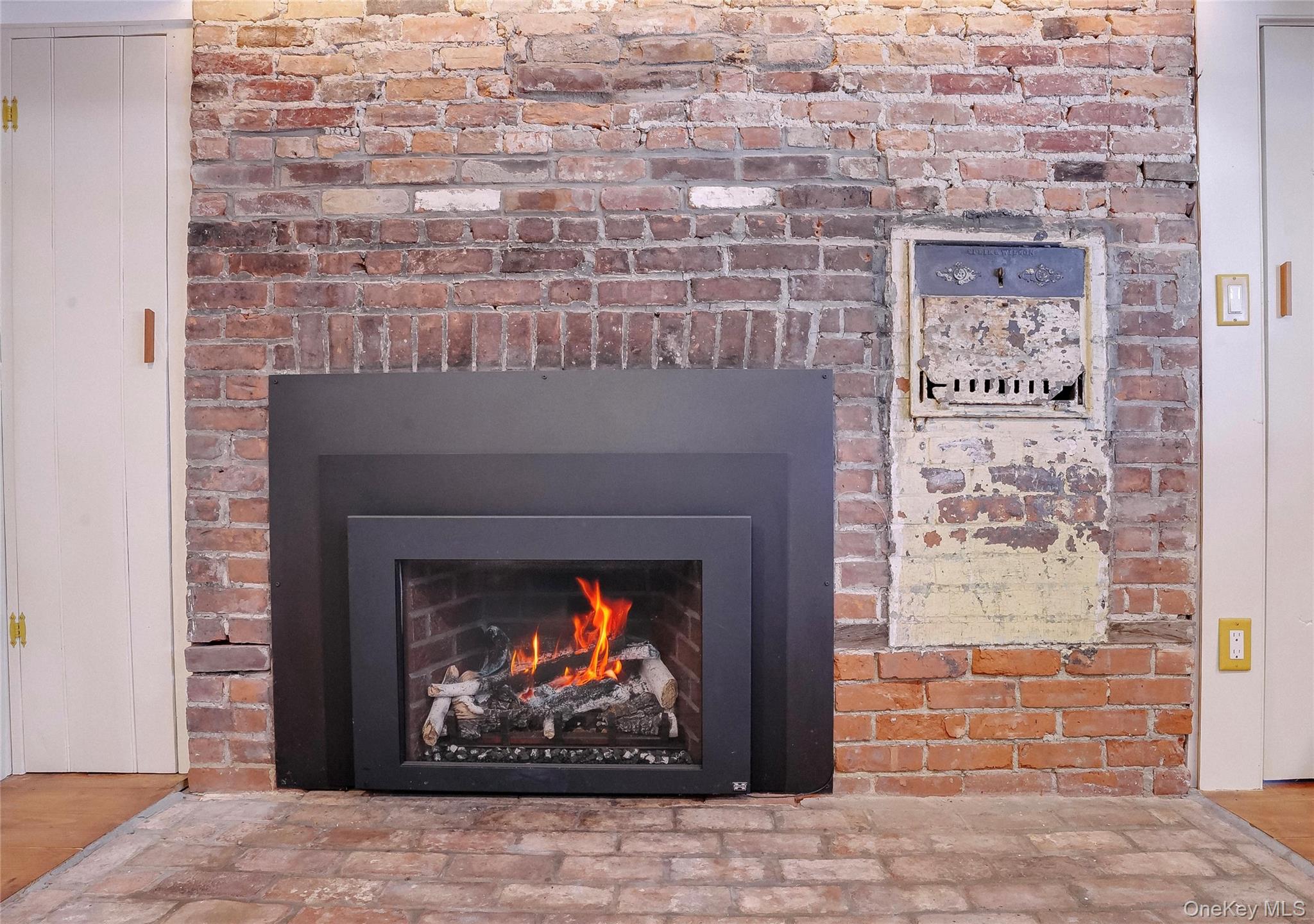 46 Union Street Montgomery, NY 12549 - Photo 26 of 38 a stone fireplace with a fireplace