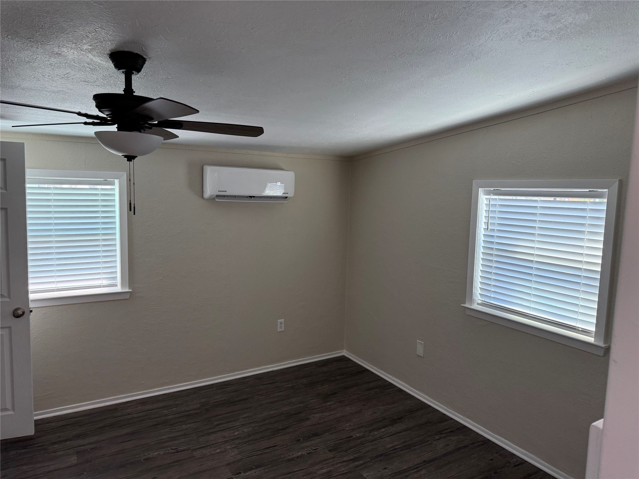 726 4th Street San Leon, TX 77539 - Photo 10 of 14 a view of an empty room with wooden floor and a window