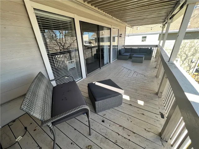 a view of swimming pool with outdoor seating and a garden
