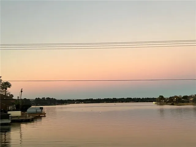 a view of a swimming pool with a yard