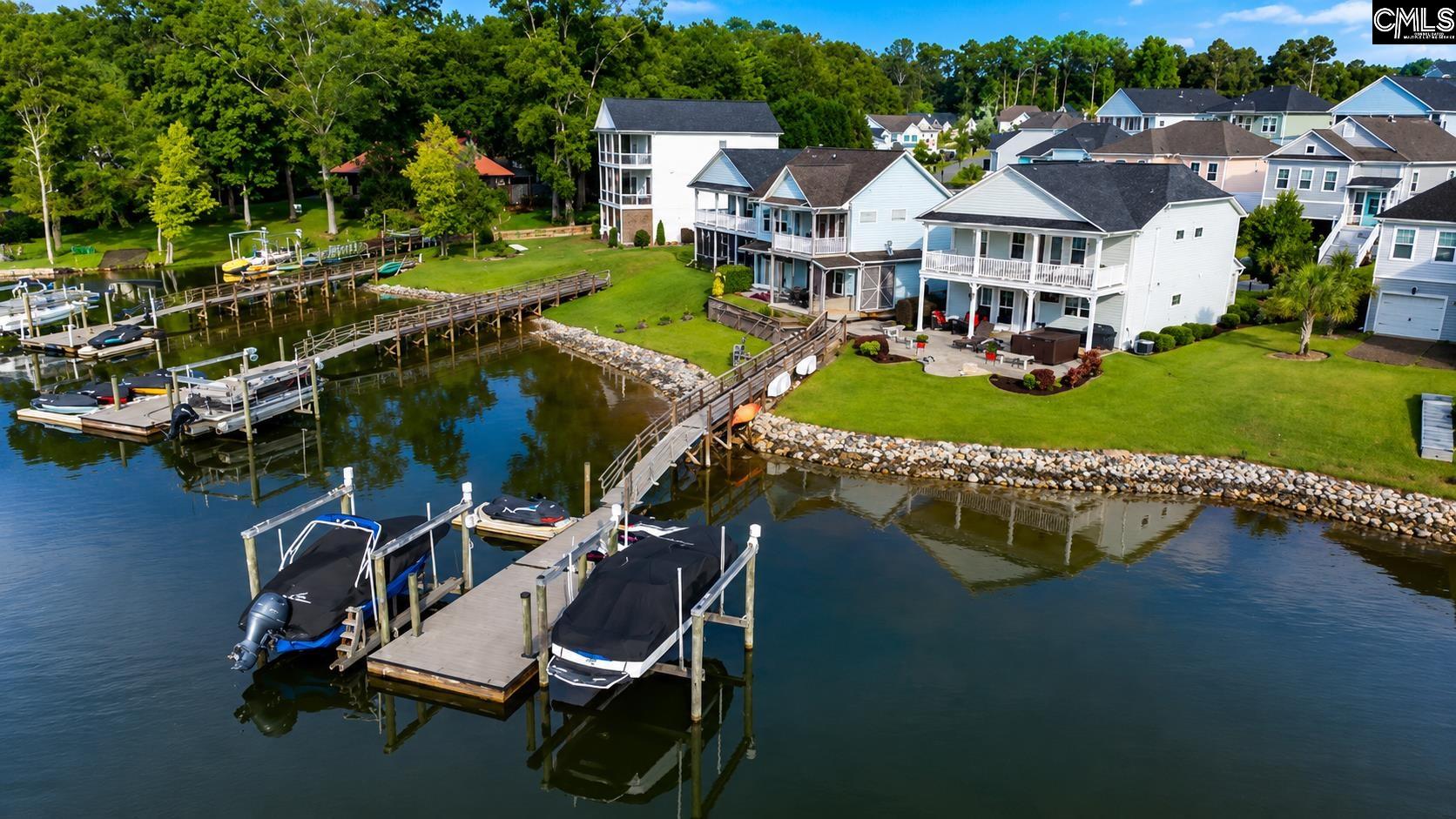 an aerial view of a house with swimming pool garden and patio