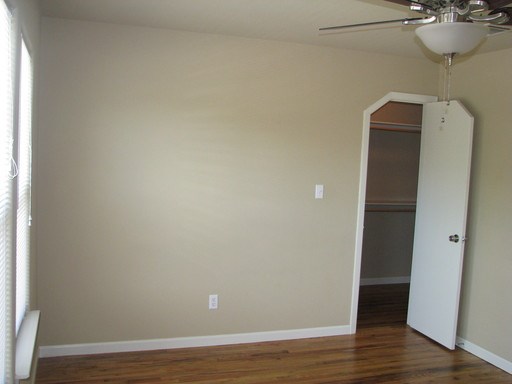 907 West 30th Street, Unit B Austin, TX 78705 - Photo 11 of 20 a view of a room with wooden floor and mirror