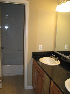 907 West 30th Street, Unit B Austin, TX 78705 - Photo 2 of 20 a bathroom with a sink and a mirror