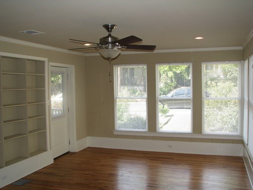 907 West 30th Street, Unit B Austin, TX 78705 - Photo 6 of 20 a view of an empty room with wooden floor and a window