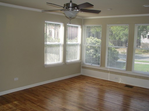 907 West 30th Street, Unit B Austin, TX 78705 - Photo 9 of 20 a view of an empty room with wooden floor and a window