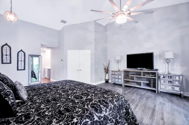 a front view of a house with a garden and a garage