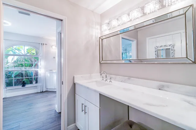 a view of a livingroom with furniture and wooden floor