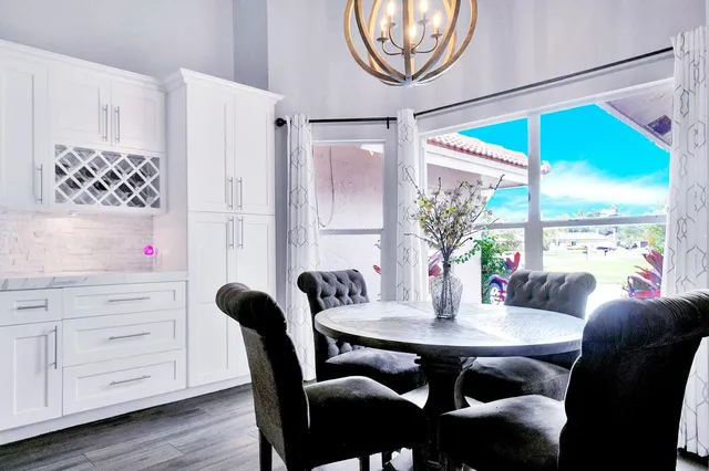 a bedroom with furniture and a flat screen tv