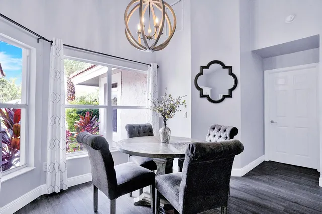 a living room with furniture flat screen tv and a fireplace