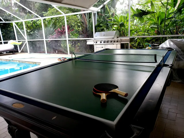 a view of a swimming pool with seating area