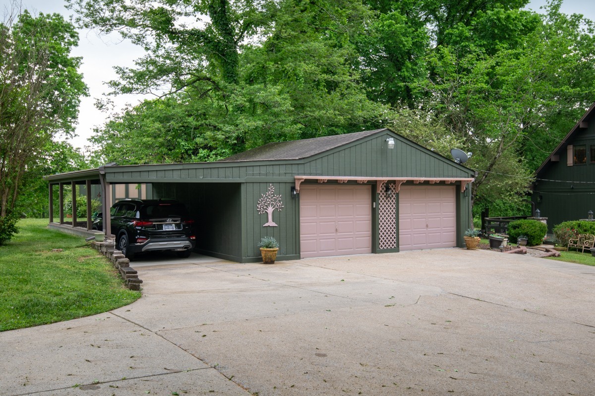 205 Allen Road Goodlettsville, TN 37072 - Photo 7 of 43 a front view of a house with a yard and garage