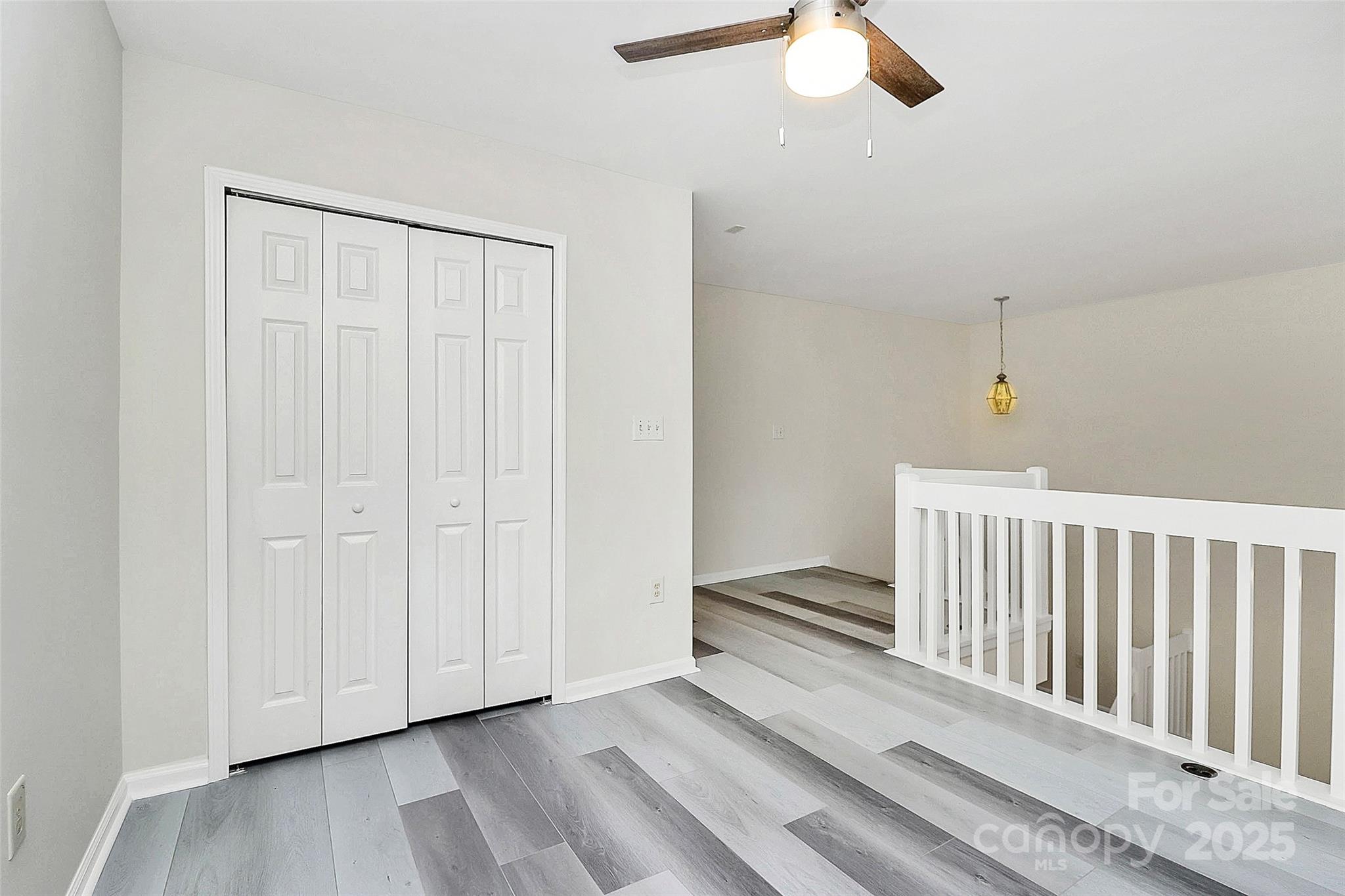 441 Robin Reed Court Pineville, NC 28134 - Photo 20 of 33 wooden floor in an empty room