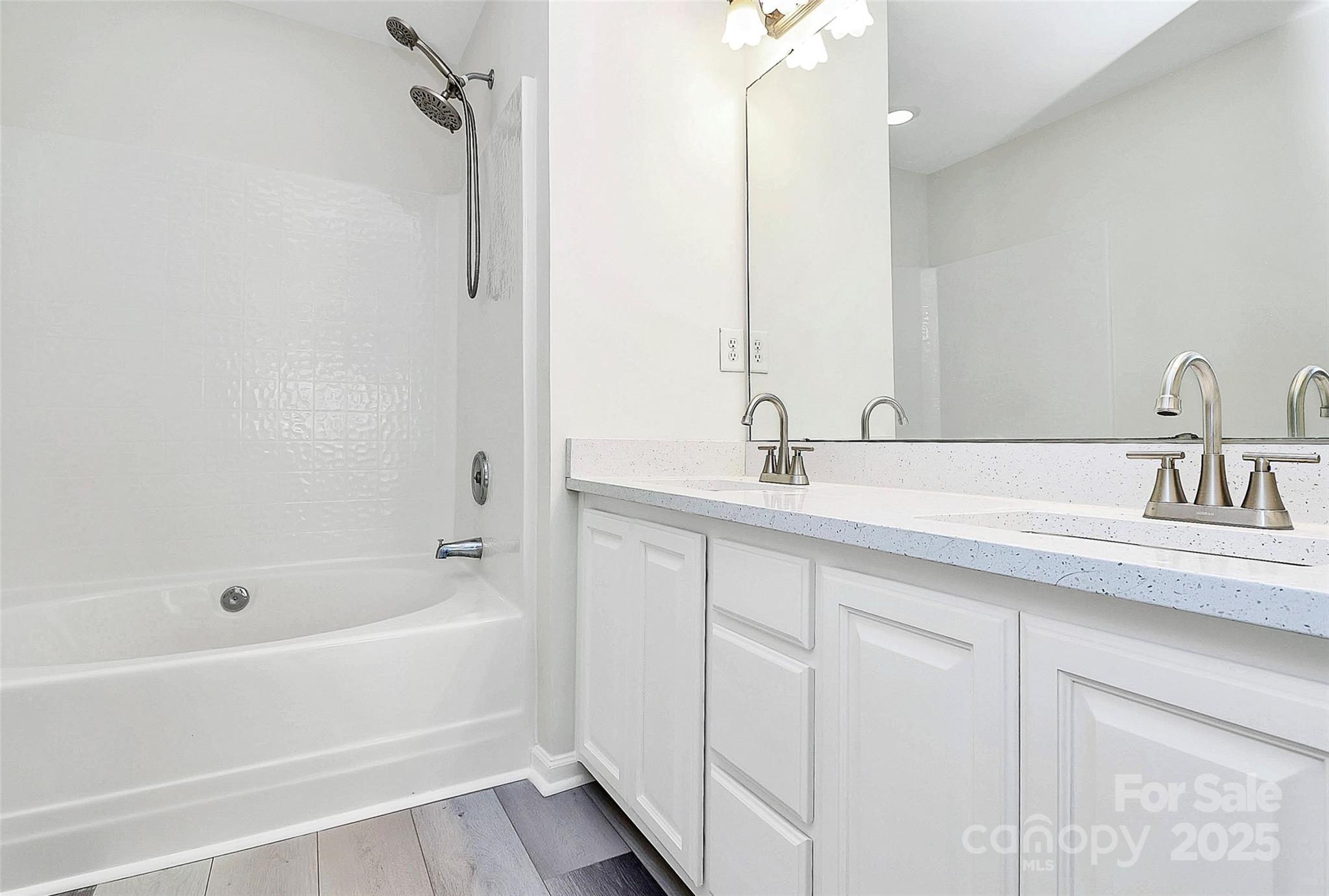 441 Robin Reed Court Pineville, NC 28134 - Photo 23 of 33 a bathroom with a tub sink and mirror